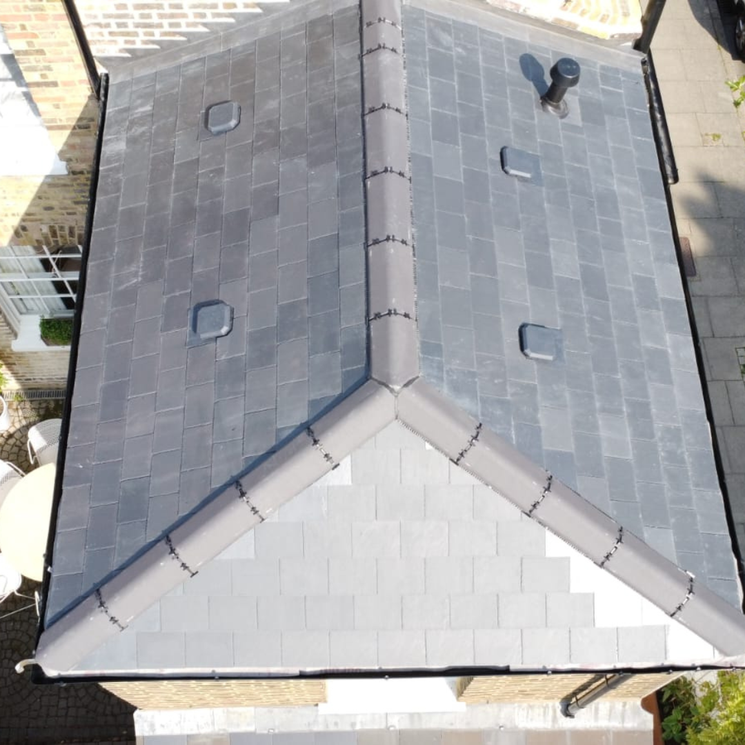 Natural slate roof repair on a Victorian house in Hackney, London